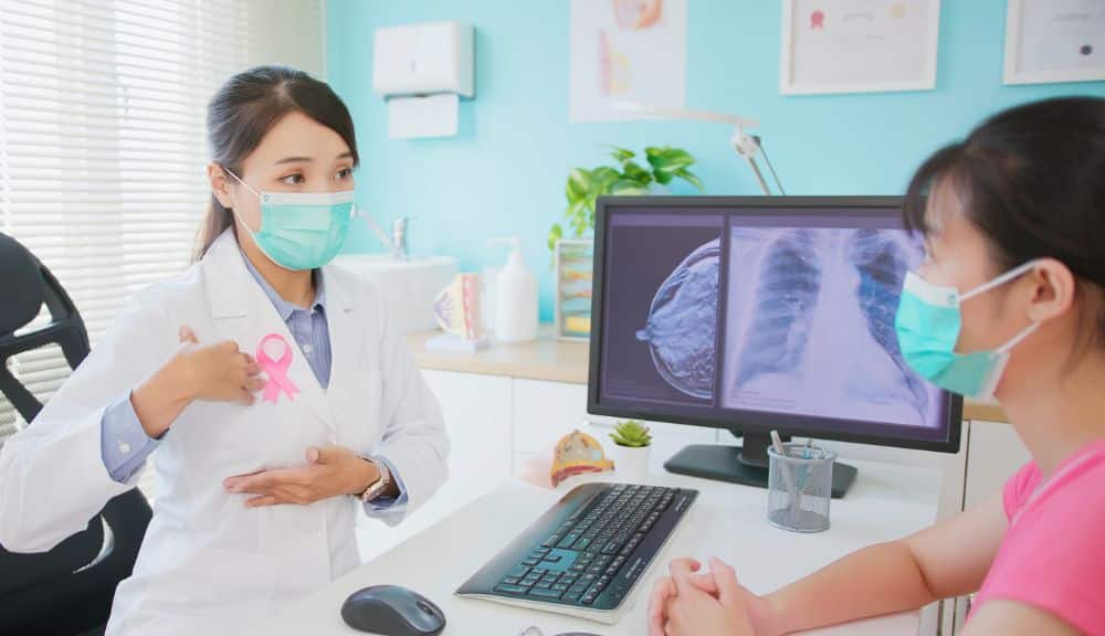 Doctor explaining breast x-ray to patient