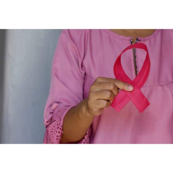 pick clothes lady holding pink ribbon